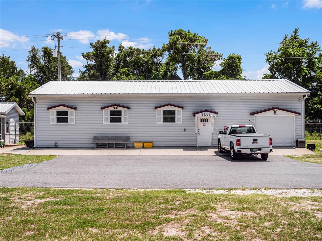 26450 Evert Street Leesburg, FL 34748 - Photo 70 of 93 a car parked in front of a house