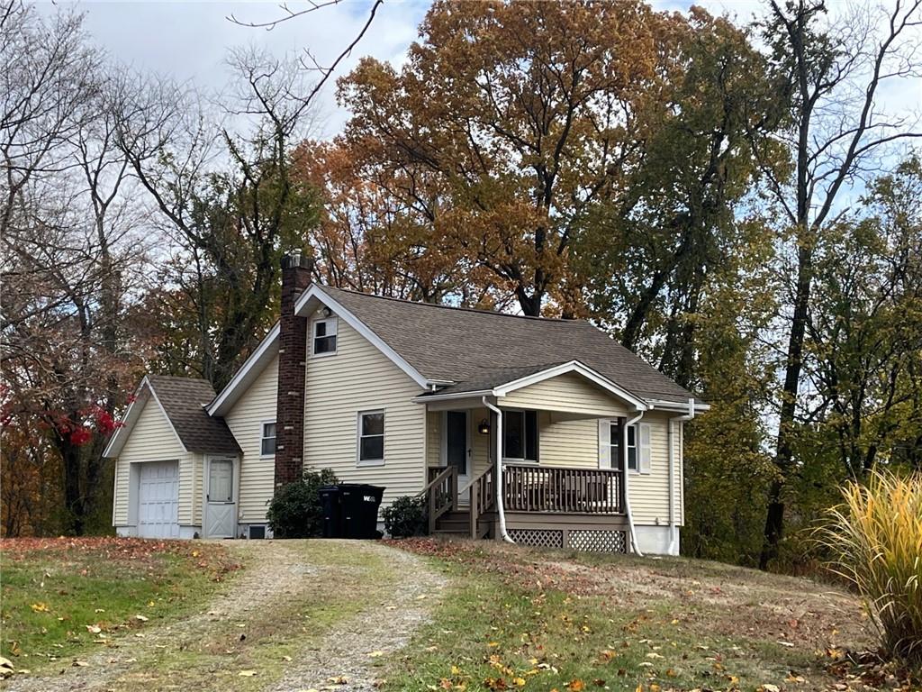 127 Longvue Drive Pittsburgh, PA 15237 - Photo 2 of 15 a front view of house with yard and trees in the background