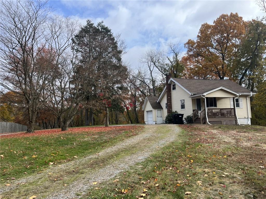 127 Longvue Drive Pittsburgh, PA 15237 - Photo 4 of 15 a view of a white house with a big yard and large trees