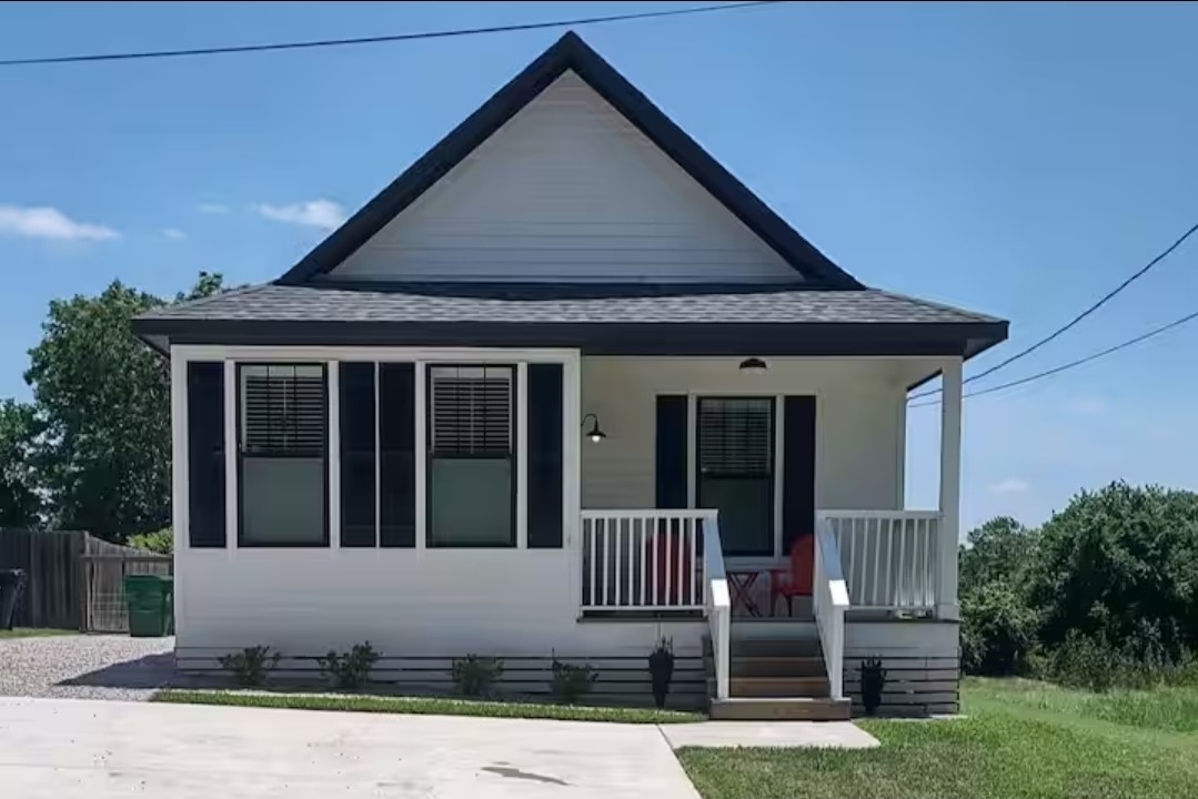 704 Burleson Street Brenham, TX 77833 - Photo 24 of 28 a front view of a house with a garden