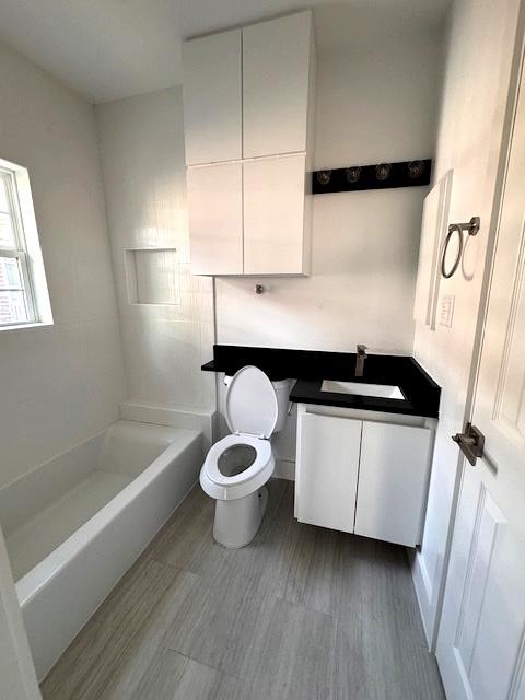 2901 Isabella Street Houston, TX 77004 - Photo 7 of 8 a bathroom with a sink a toilet and bathtub