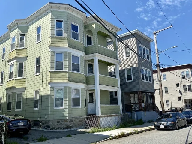 a front view of a building with street view