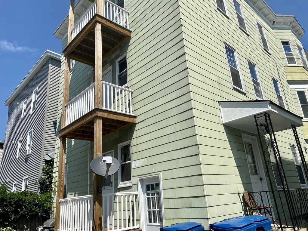 4 Conduit Street, Unit 1 Lawrence, MA 01841 - Photo 2 of 14 a front view of a house