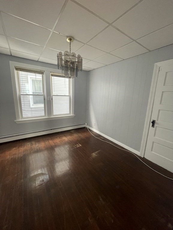 4 Conduit Street, Unit 1 Lawrence, MA 01841 - Photo 10 of 14 an empty room with wooden floor and windows