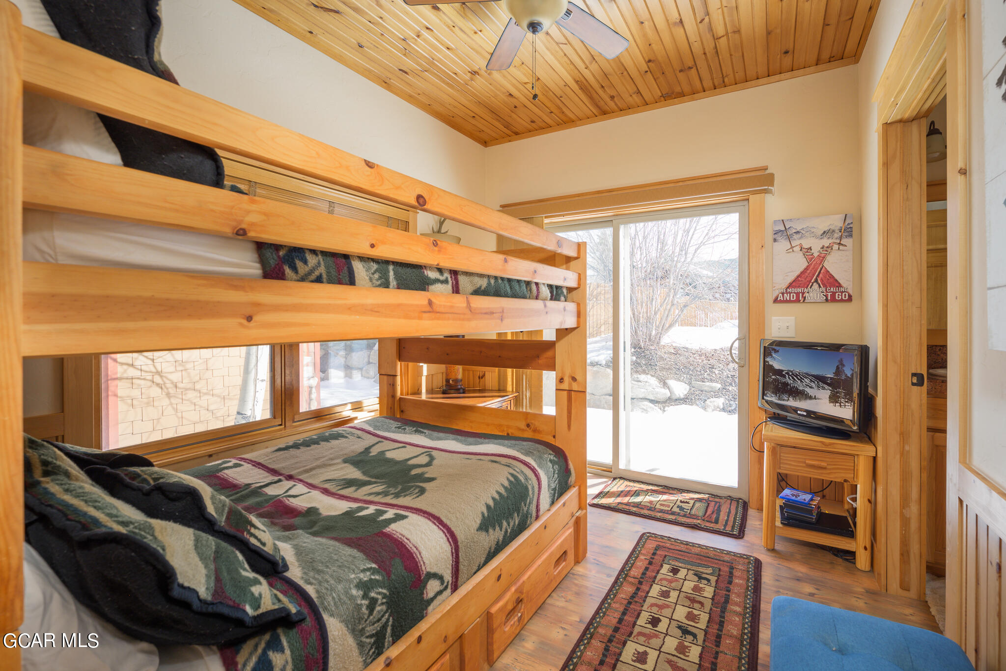 129 Edgewater Circle Granby, CO 80446 - Photo 11 of 63 a bedroom with a bed and a bookshelf