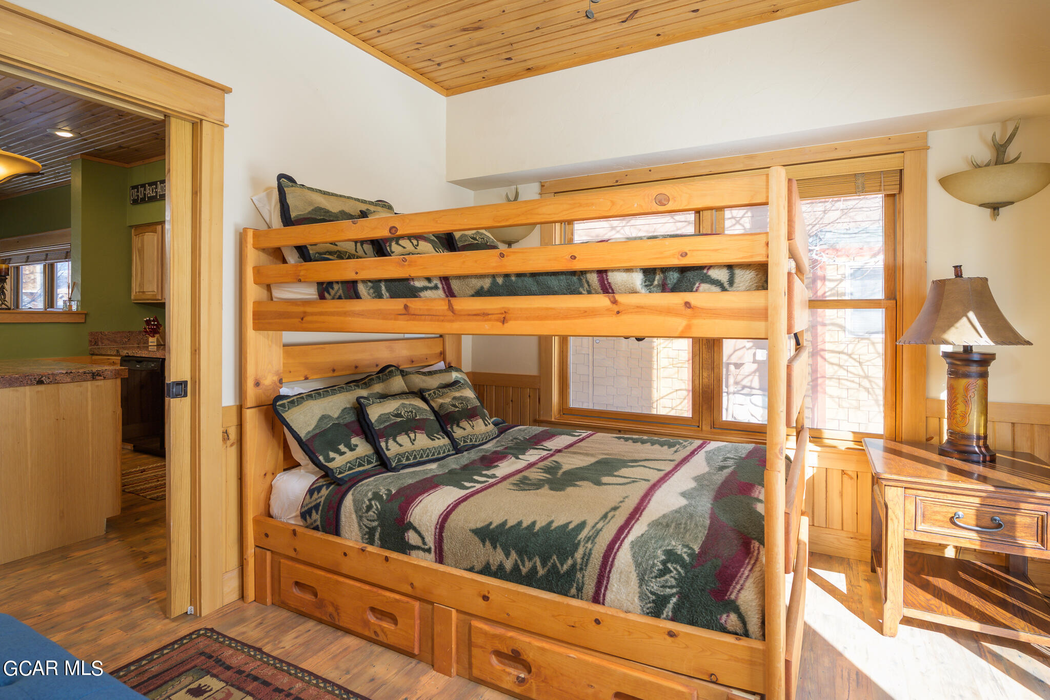 129 Edgewater Circle Granby, CO 80446 - Photo 12 of 63 a bed sitting in a bedroom next to a window