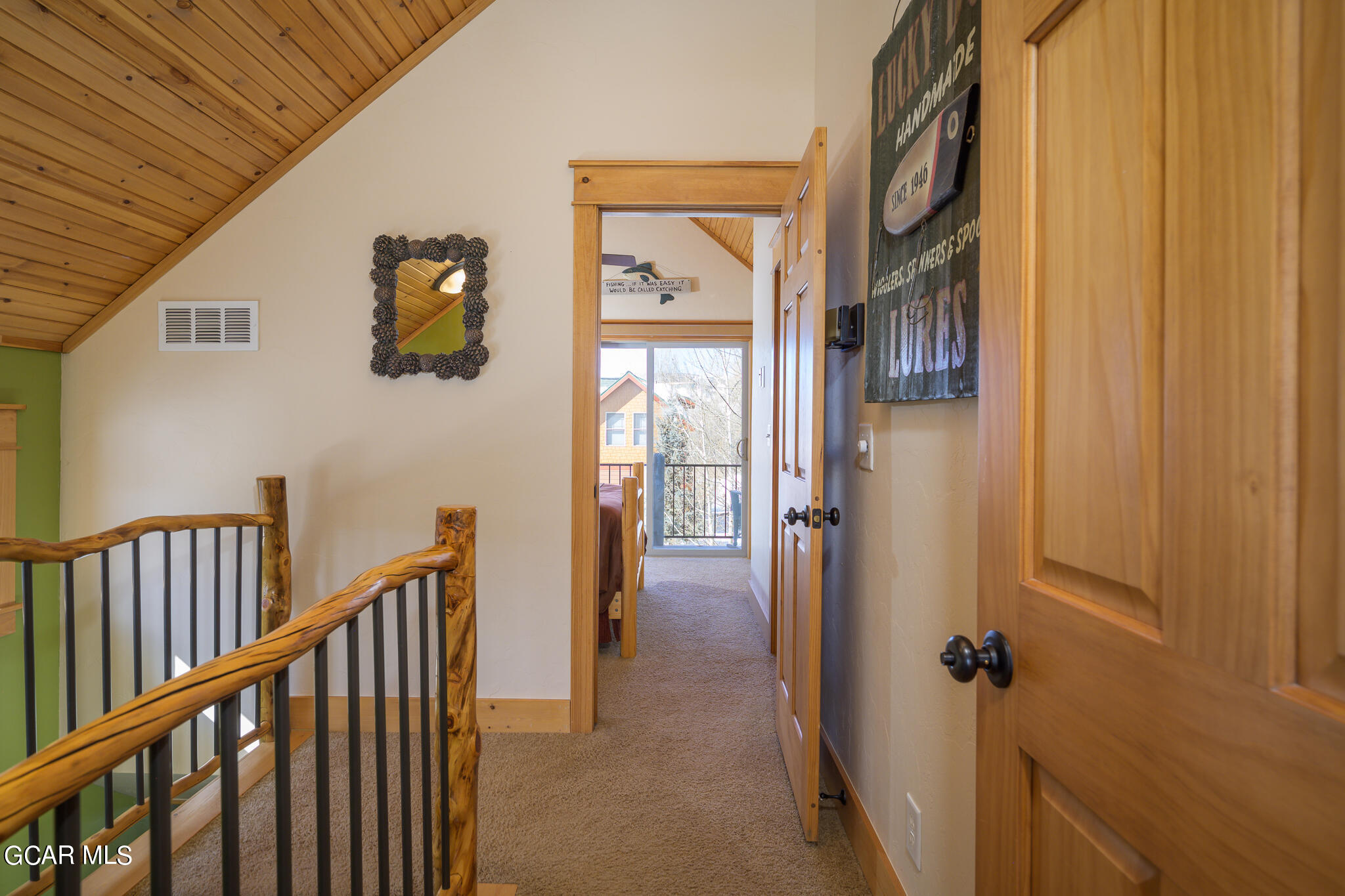 129 Edgewater Circle Granby, CO 80446 - Photo 18 of 63 a view of a hallway with wooden floor and front door