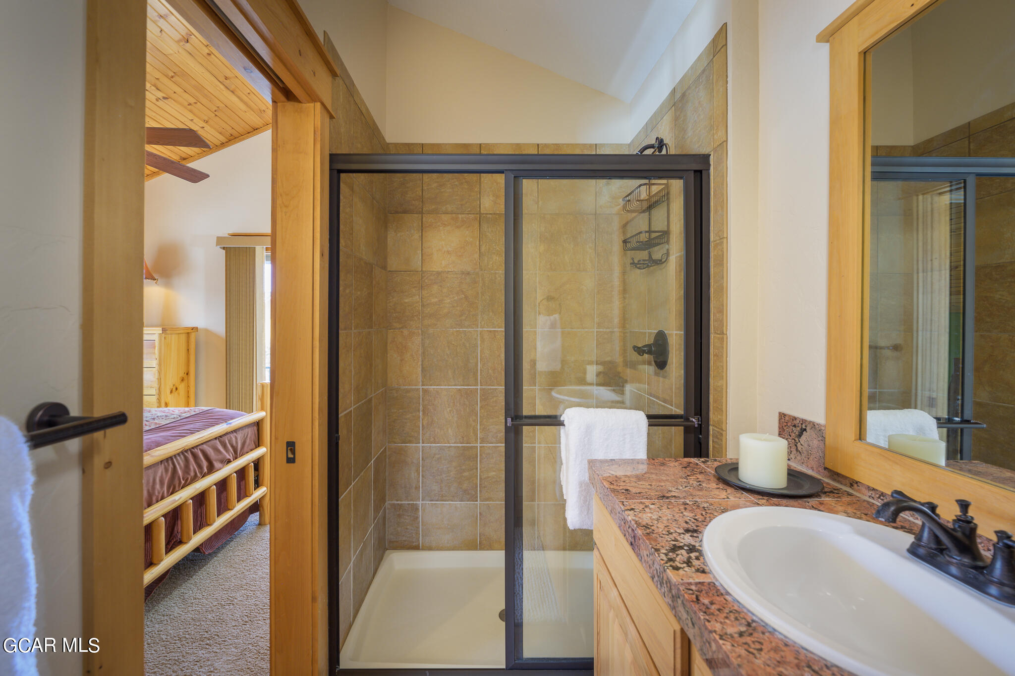 129 Edgewater Circle Granby, CO 80446 - Photo 22 of 63 a bathroom with a tub a sink and a mirror