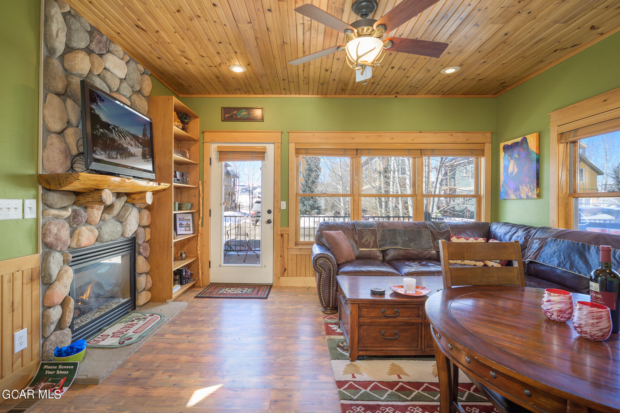 129 Edgewater Circle Granby, CO 80446 - Photo 4 of 63 a living room with furniture and a fireplace