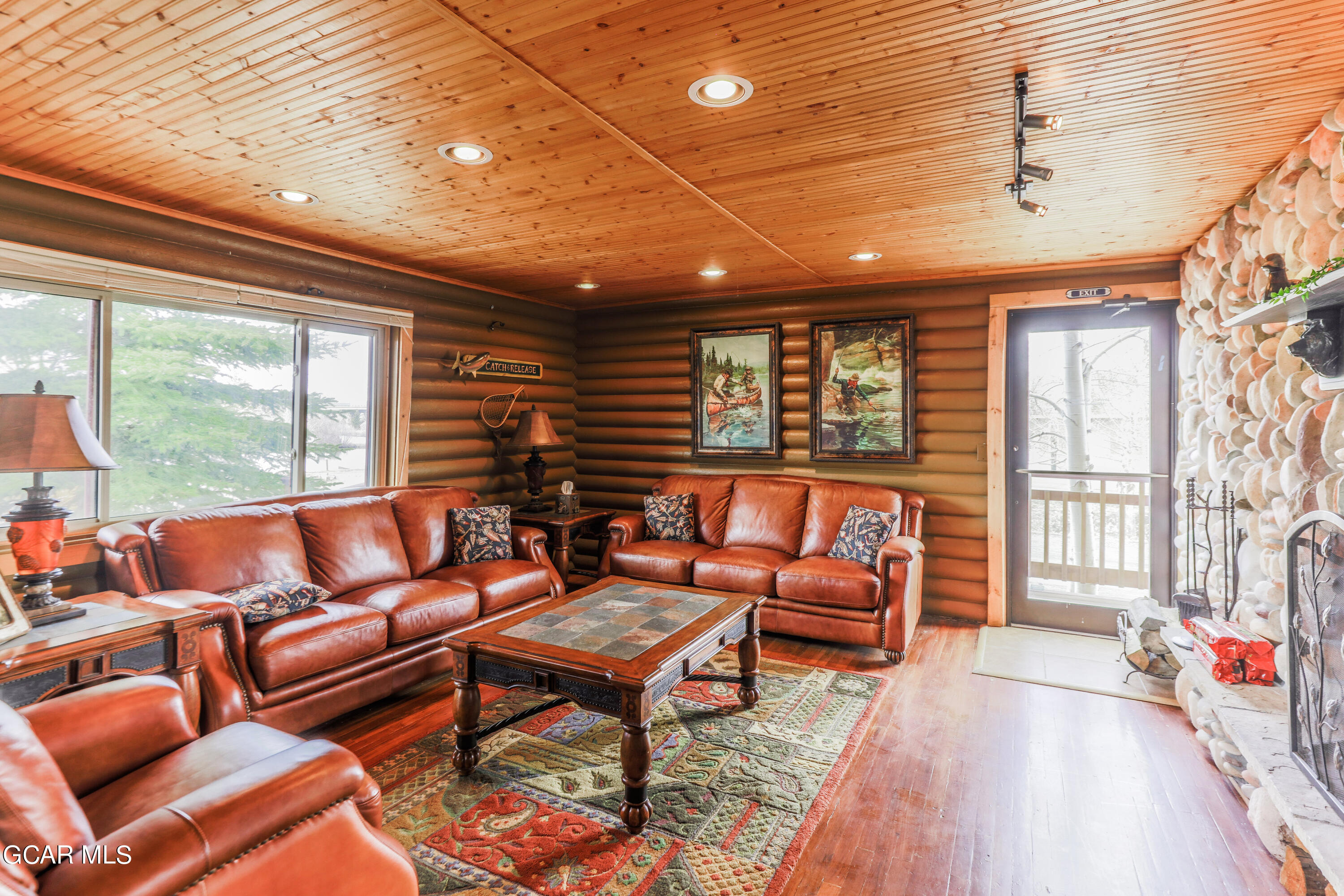 129 Edgewater Circle Granby, CO 80446 - Photo 57 of 63 a outdoor living space with furniture and a floor to ceiling window