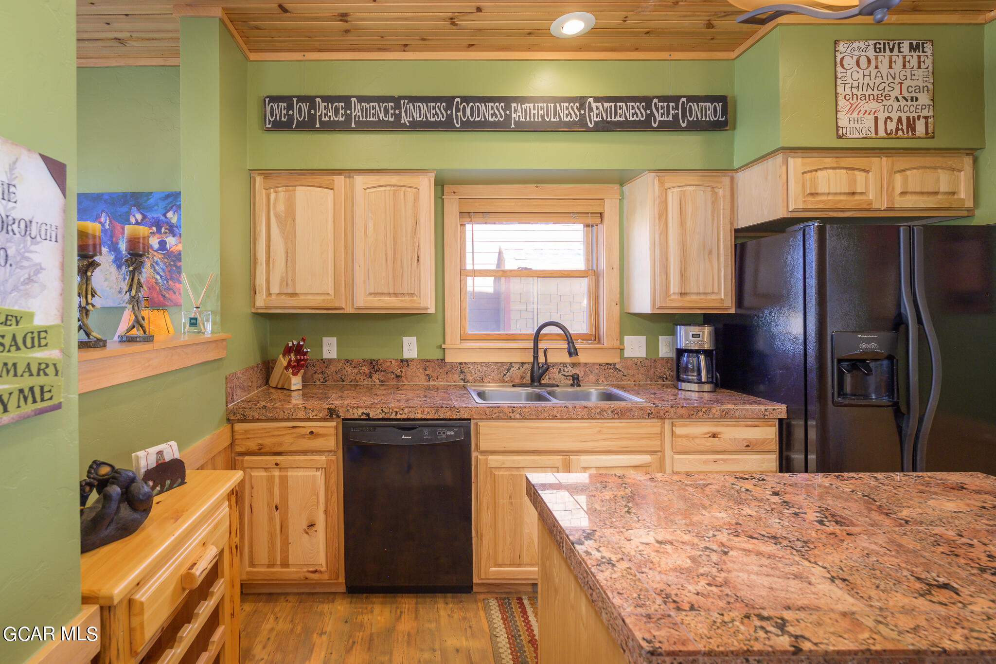 129 Edgewater Circle Granby, CO 80446 - Photo 7 of 63 a kitchen with stainless steel appliances granite countertop a sink and a refrigerator