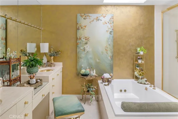 a bathroom with a tub and shower