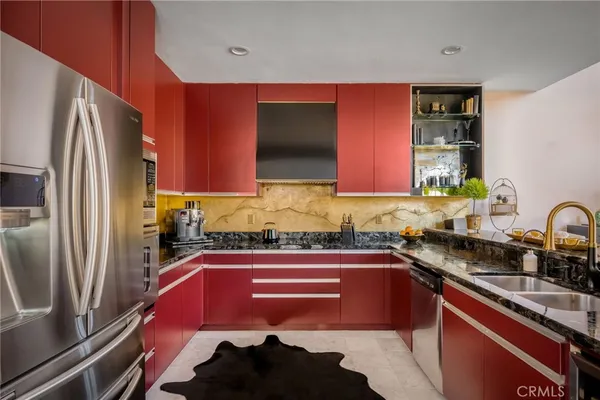 a kitchen with a sink stove and refrigerator