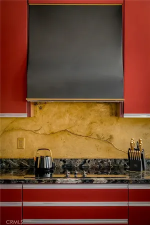 a kitchen with a stove a sink and a microwave