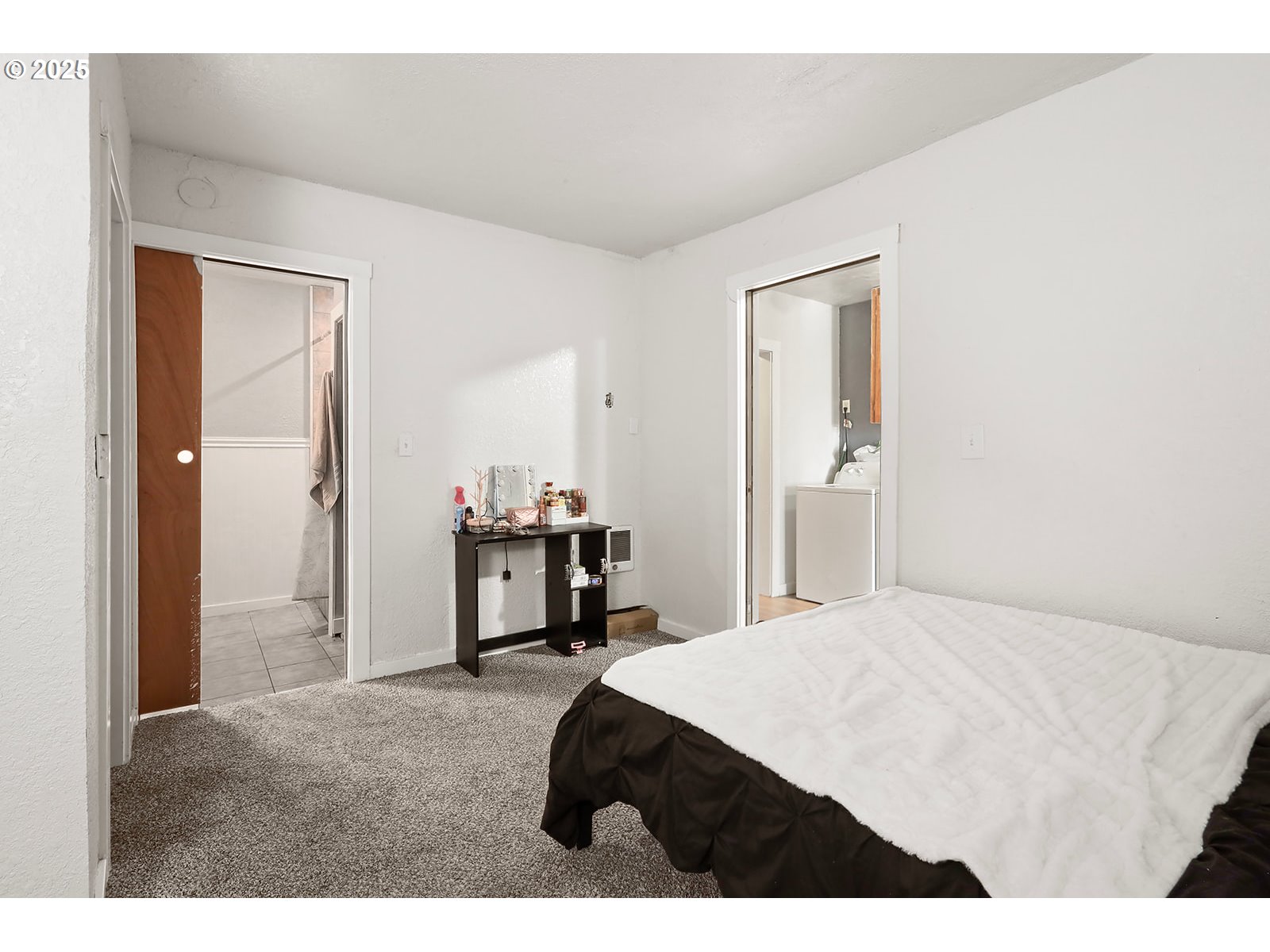 812 East 15th Street The Dalles, OR 97058 - Photo 14 of 41 a bedroom with a bed and a table