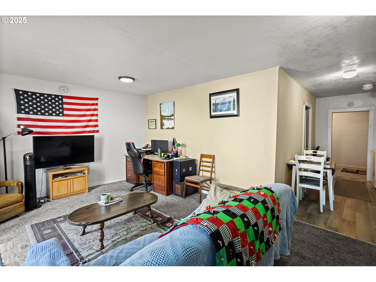 812 East 15th Street The Dalles, OR 97058 - Photo 18 of 41 a living room with furniture a flat screen tv and a dining table