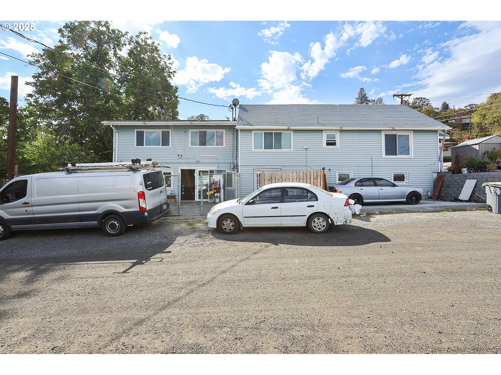 812 East 15th Street The Dalles, OR 97058 - Photo 2 of 41 a view of cars parked in front of a house