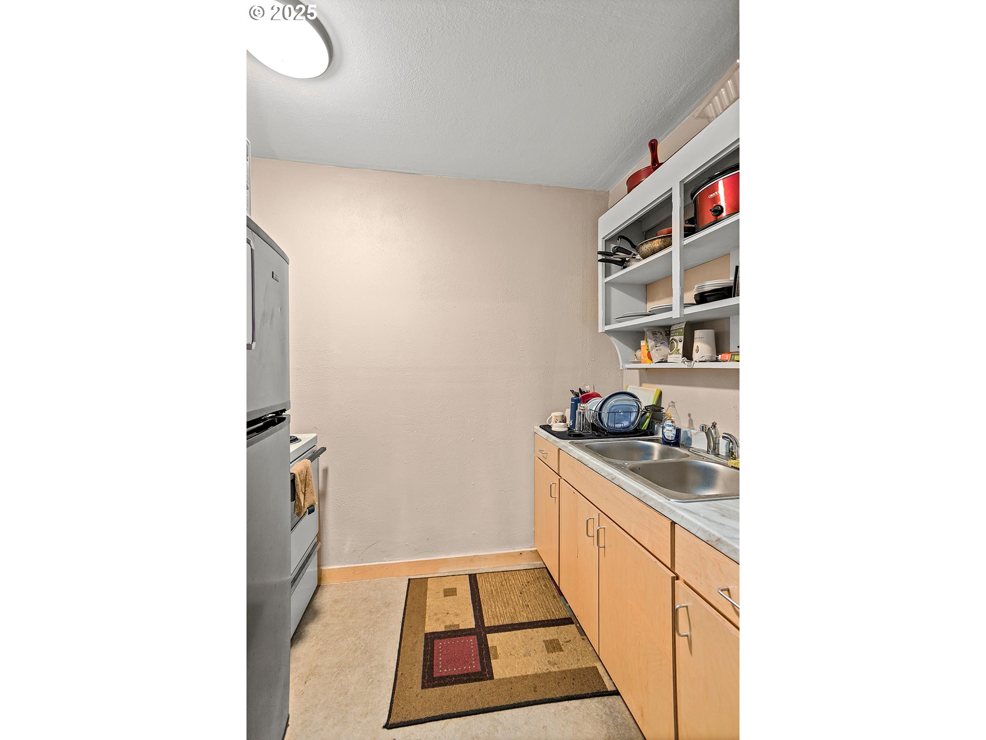 812 East 15th Street The Dalles, OR 97058 - Photo 21 of 41 a kitchen with a sink and cabinets