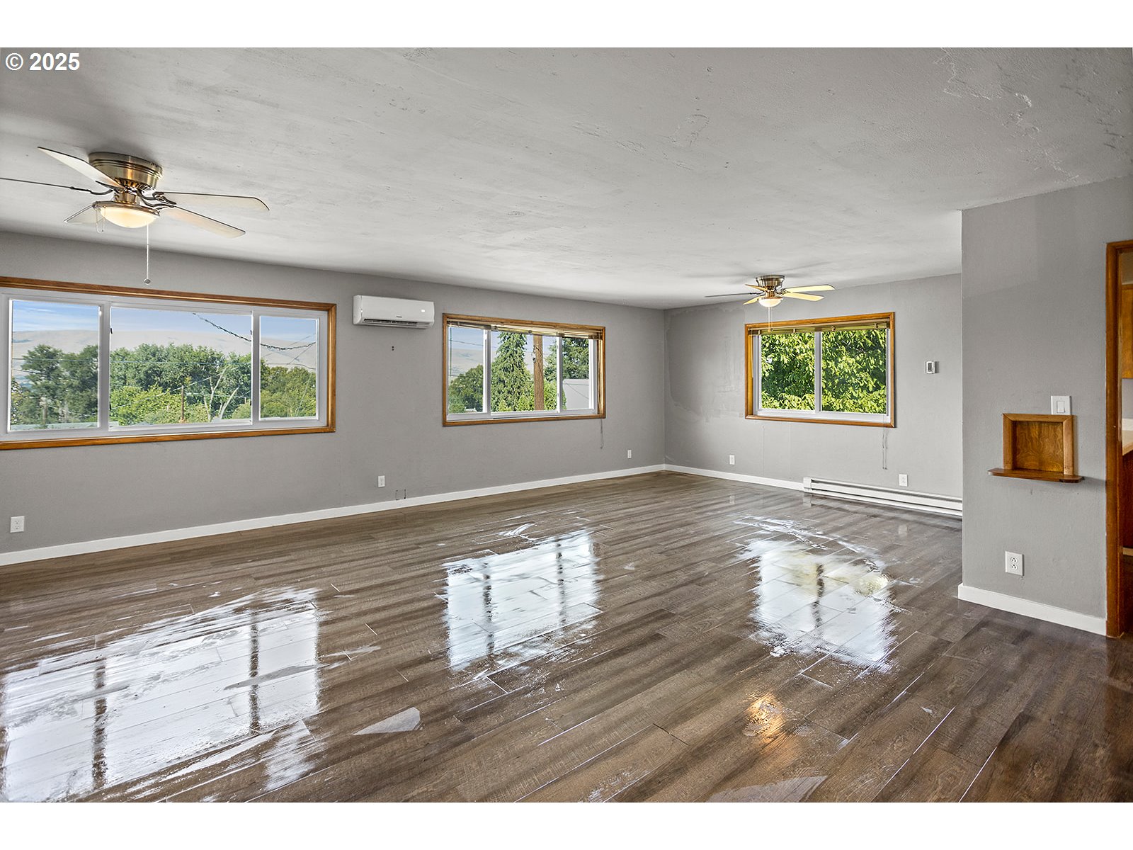 812 East 15th Street The Dalles, OR 97058 - Photo 35 of 41 a view of empty room with wooden floor and fan