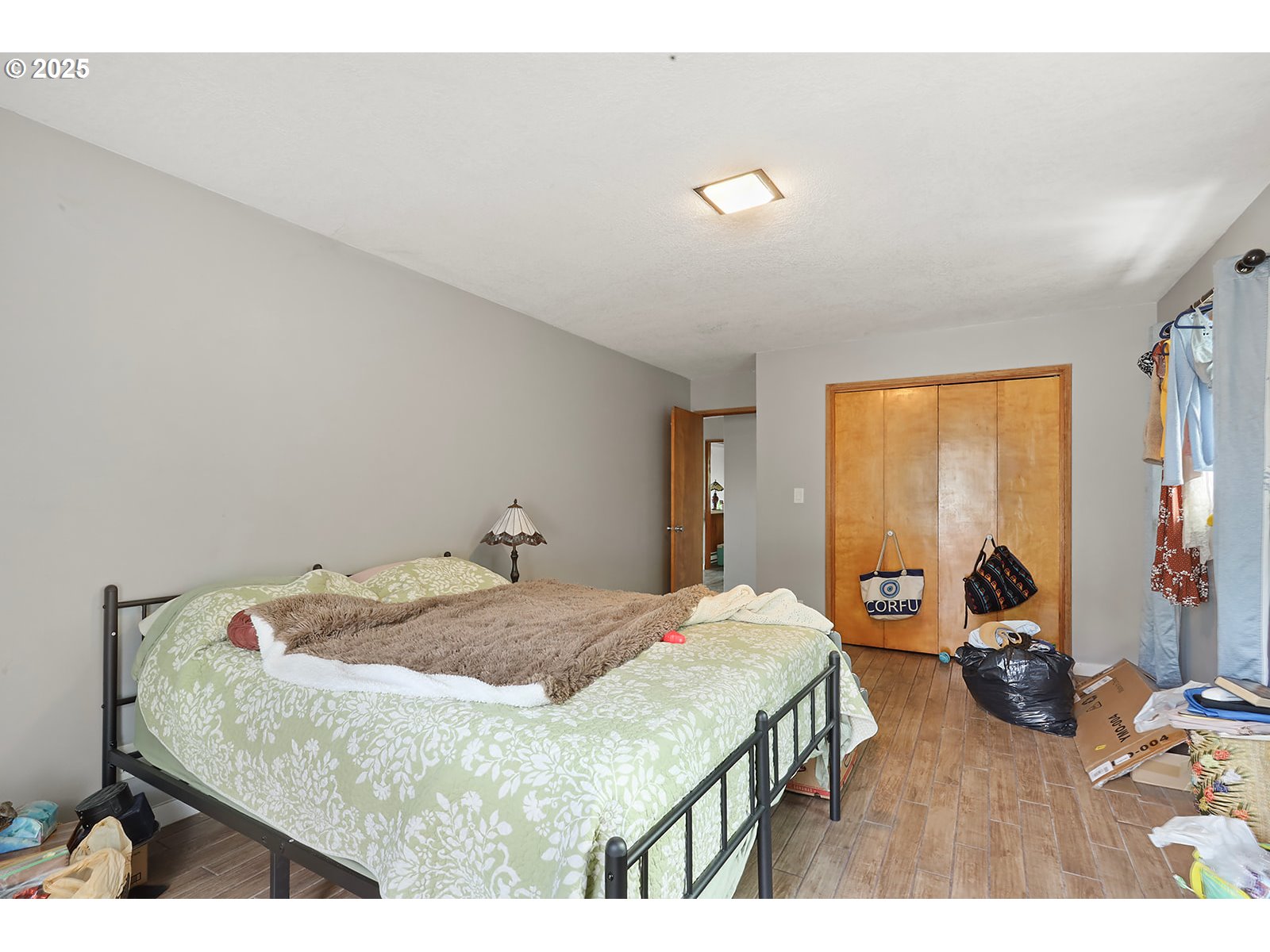 812 East 15th Street The Dalles, OR 97058 - Photo 8 of 41 a bedroom with a bed and wooden floor