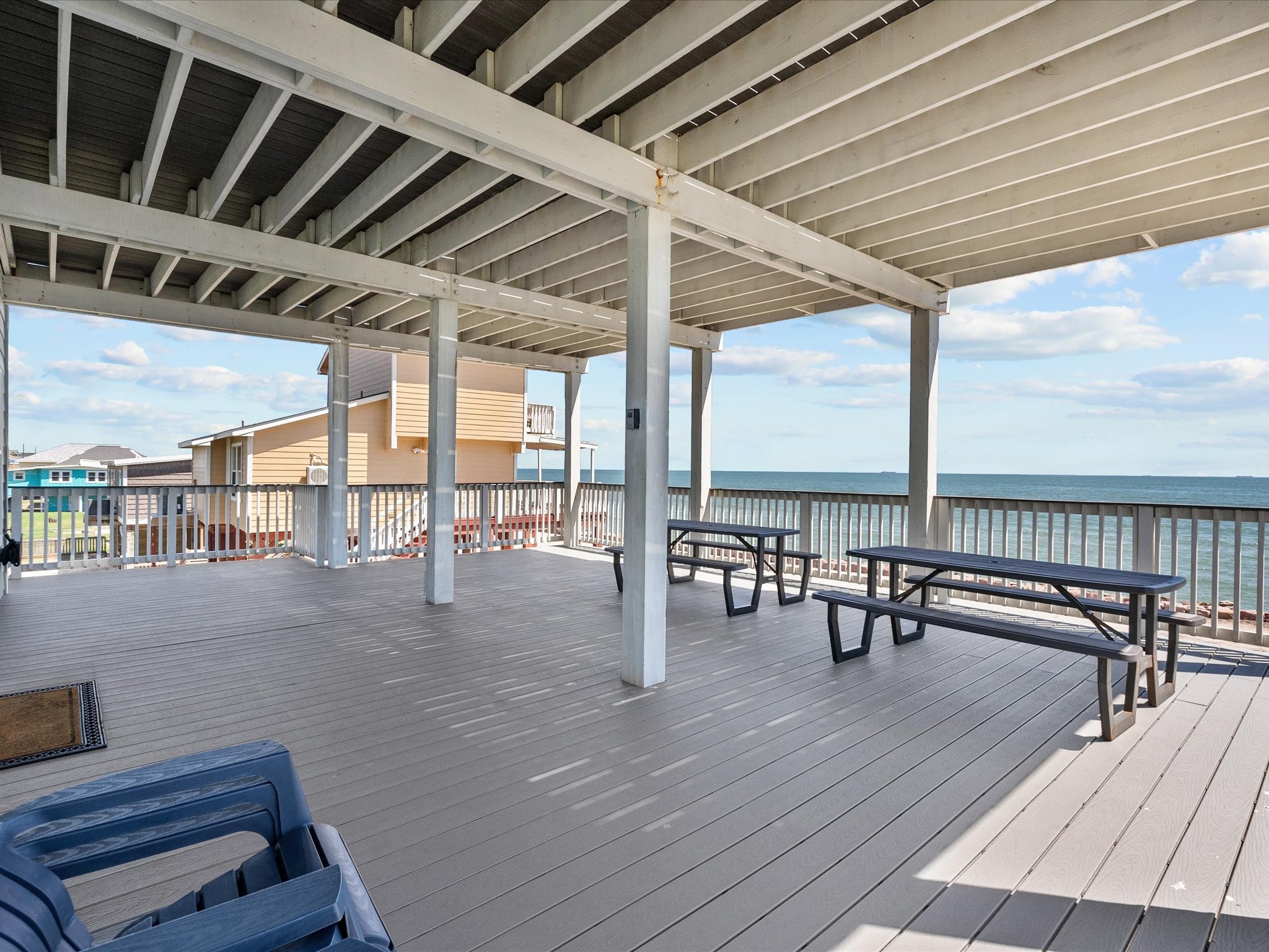 718 Beach Drive Surfside Beach, TX 77541 - Photo 8 of 49 Stunning stilted coastal homes with breathtaking waterfront views and direct rocky shoreline access. Enjoy a peaceful beachside atmosphere ideal for relaxation or vacation living.
