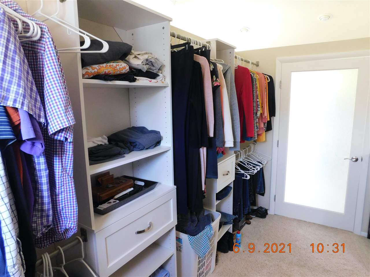 705 Ash Drive Grand Junction, CO 81506 - Photo 13 of 21 a view of walk in closet with clothes and shoes