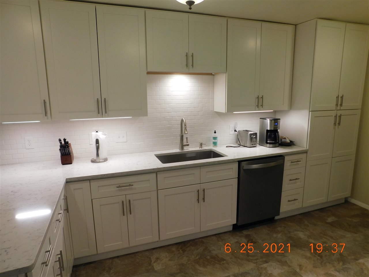 705 Ash Drive Grand Junction, CO 81506 - Photo 17 of 21 a kitchen with a sink cabinets and appliances
