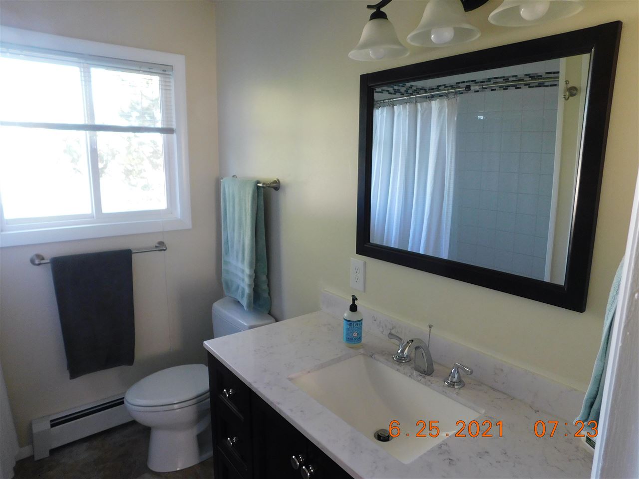 705 Ash Drive Grand Junction, CO 81506 - Photo 6 of 21 a bathroom with a sink toilet and mirror