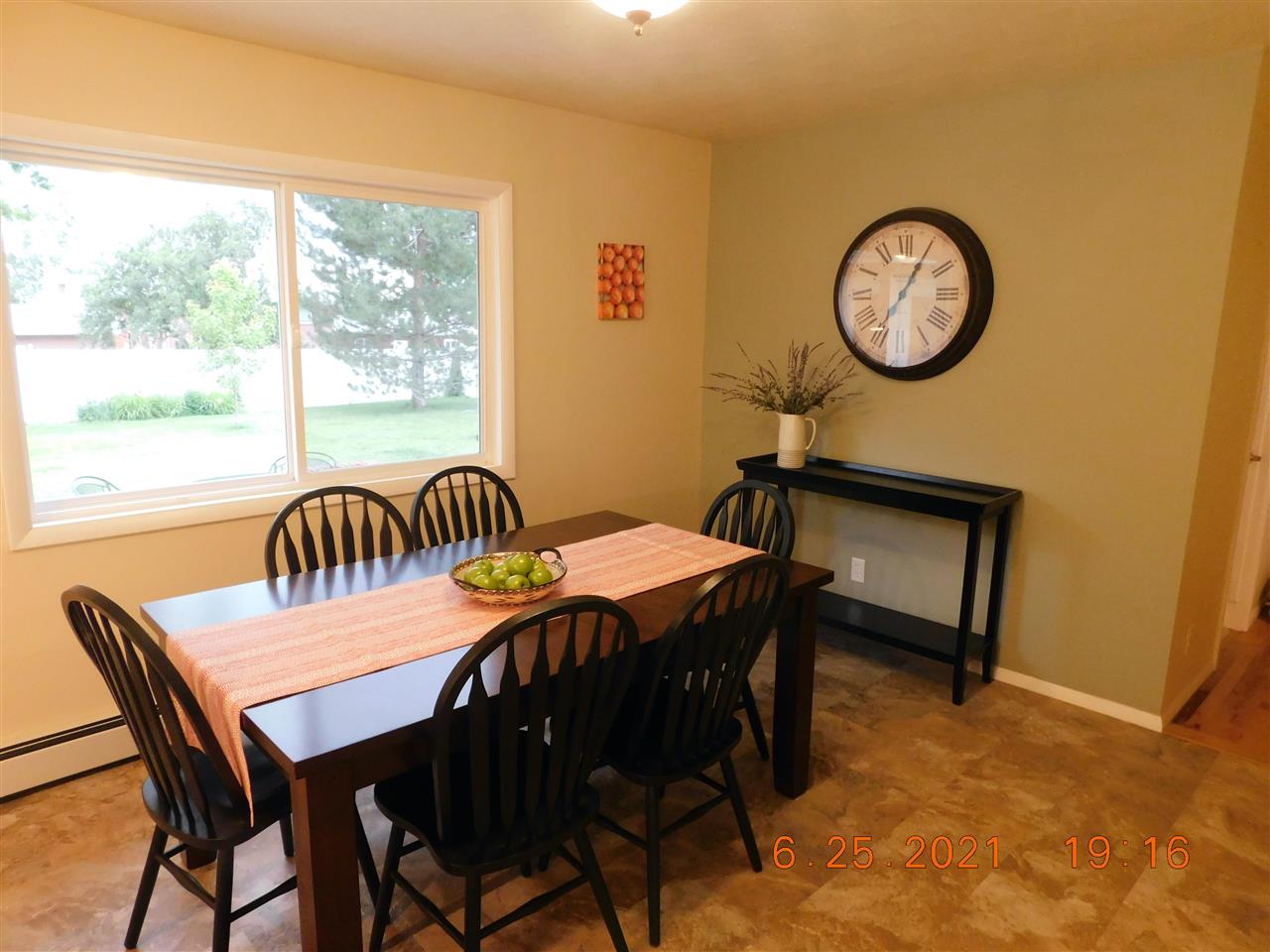705 Ash Drive Grand Junction, CO 81506 - Photo 8 of 21 a view of a dining area with furniture and a window