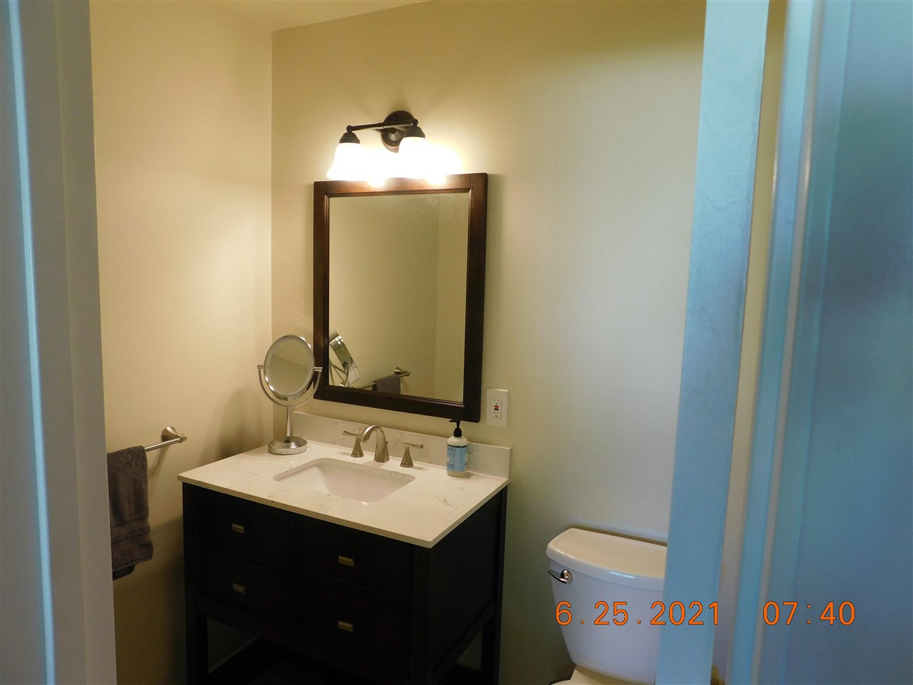 705 Ash Drive Grand Junction, CO 81506 - Photo 9 of 21 a bathroom with a toilet sink and mirror