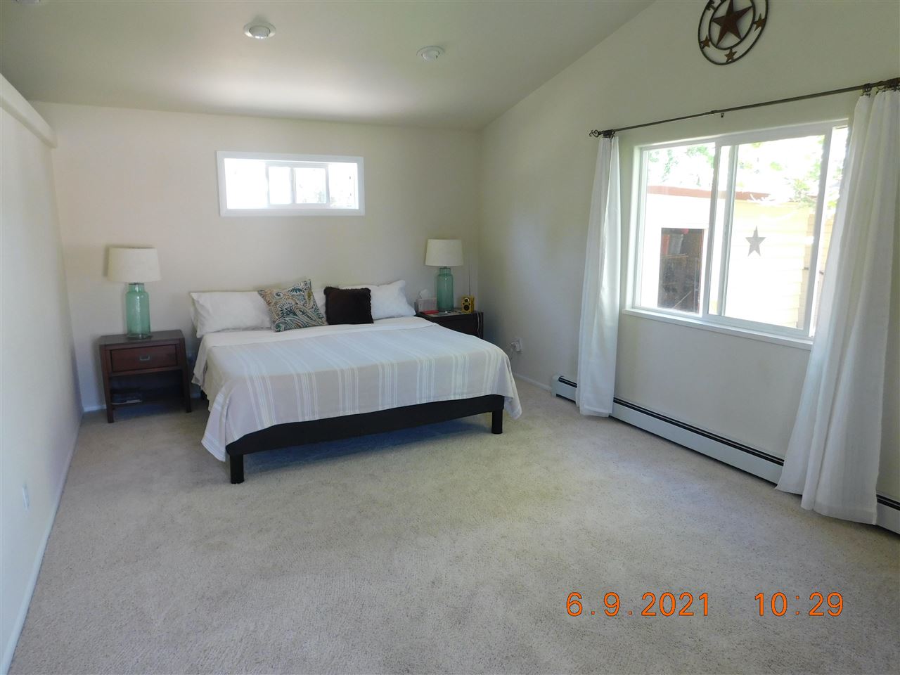 705 Ash Drive Grand Junction, CO 81506 - Photo 10 of 21 a spacious bedroom with a bed and a window