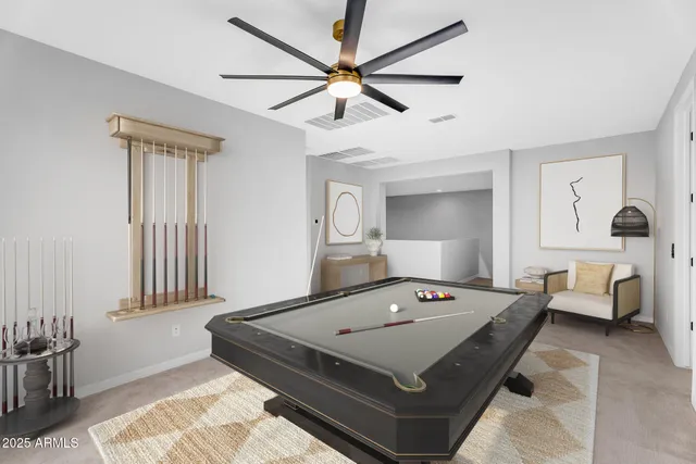 a living room with a bed furniture and a window