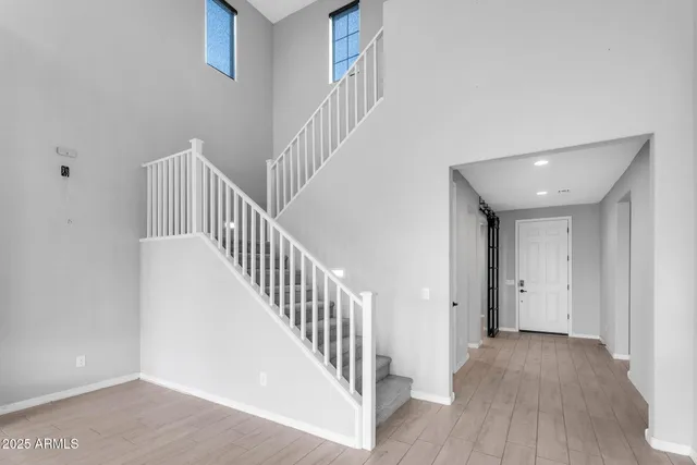 a view of an entryway with wooden floor