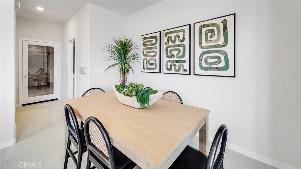 2577 Cloudview Privado Ontario, CA 91761 - Photo 4 of 19 a view of a dining room with furniture and window