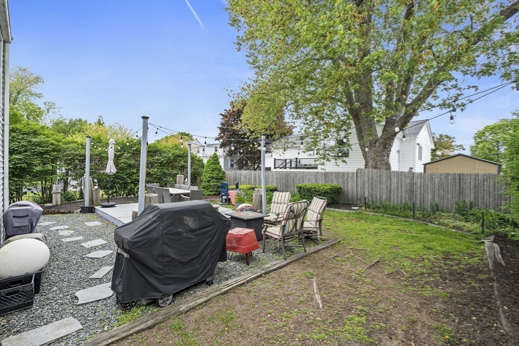 15 D Street Hull, MA 02045 - Photo 30 of 42 a view of a backyard with sitting area and furniture