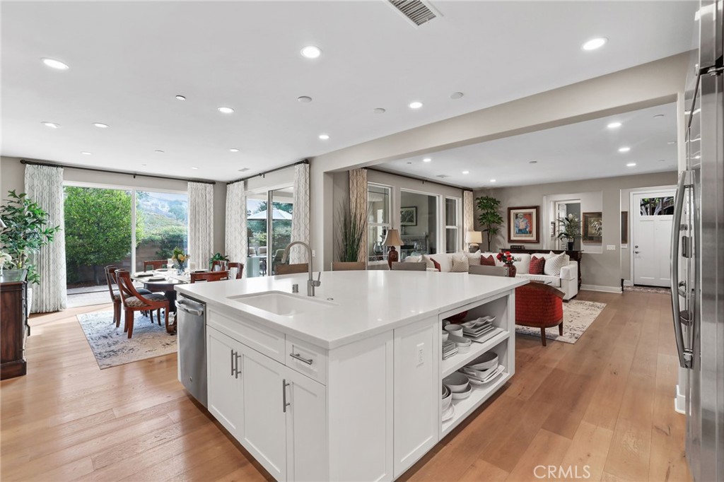 24 Risa Street Rancho Mission Viejo, CA 92694 - Photo 1 of 1 Spacious and modern kitchen with an open layout and hardwood floors.