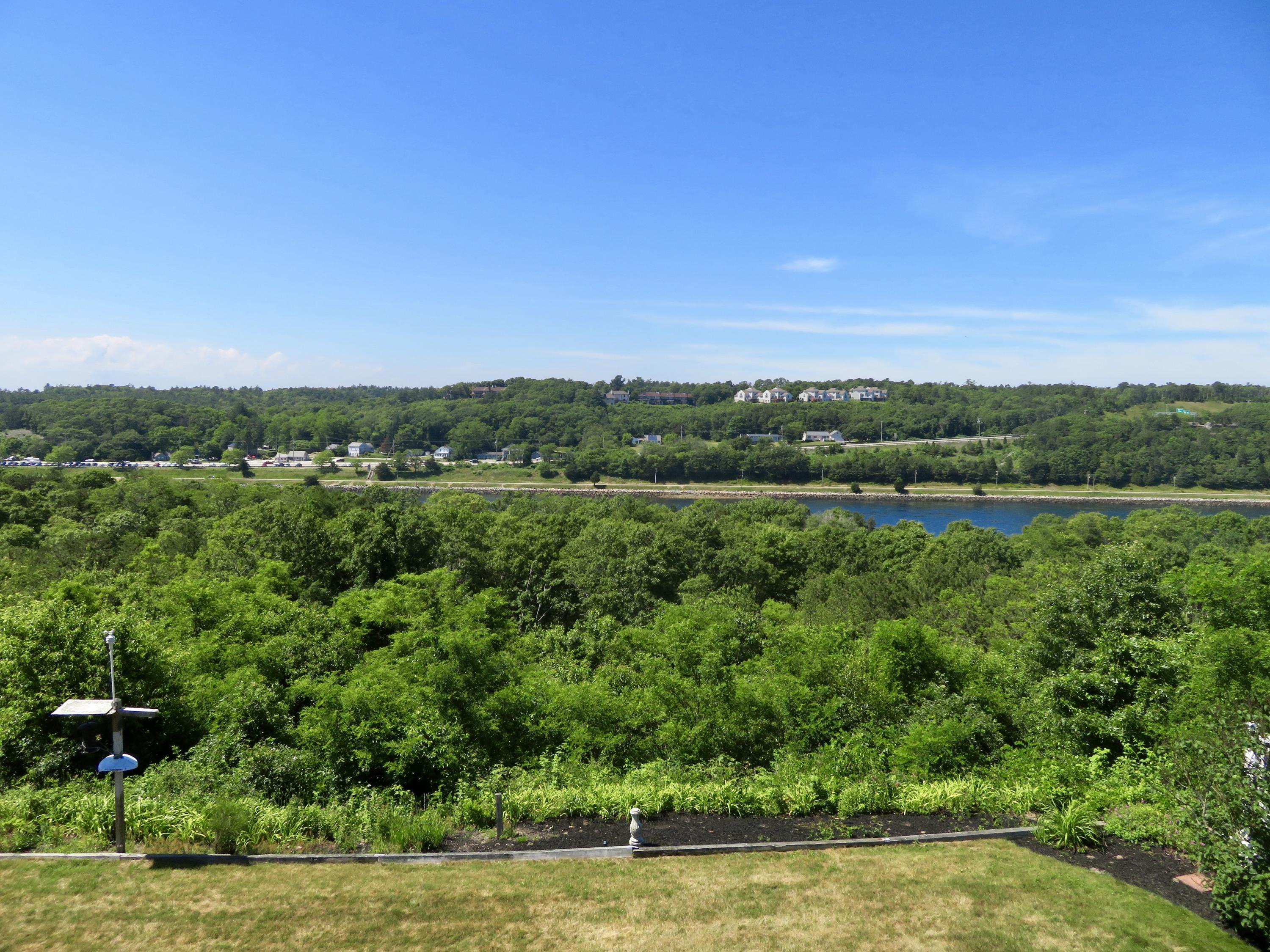 19 Long Boat Road Bourne, MA 02532 - Photo 19 of 33 a view of a green field with lots of bushes