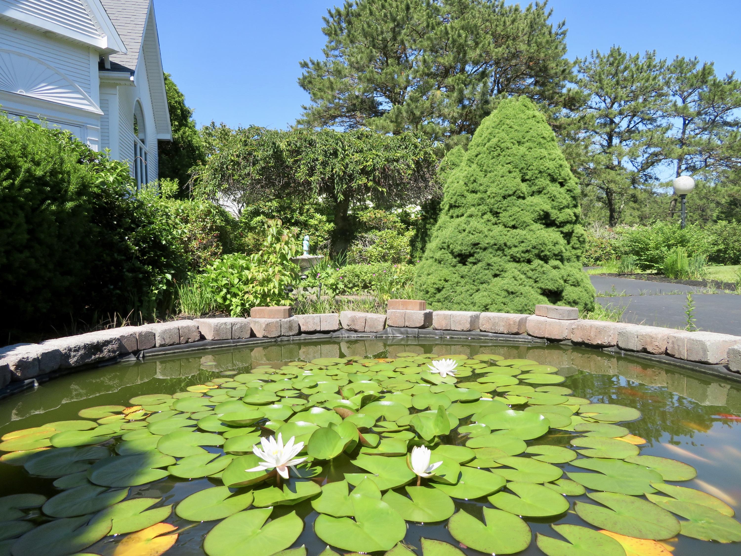 19 Long Boat Road Bourne, MA 02532 - Photo 23 of 33 a view of a swimming pool with a patio