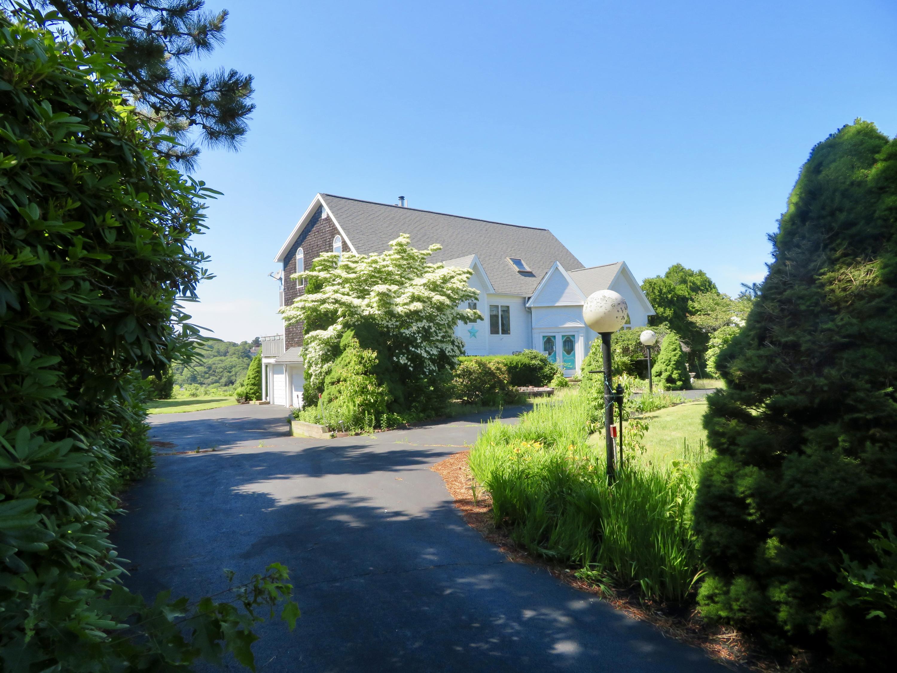 19 Long Boat Road Bourne, MA 02532 - Photo 24 of 33 a view of a back yard of the house
