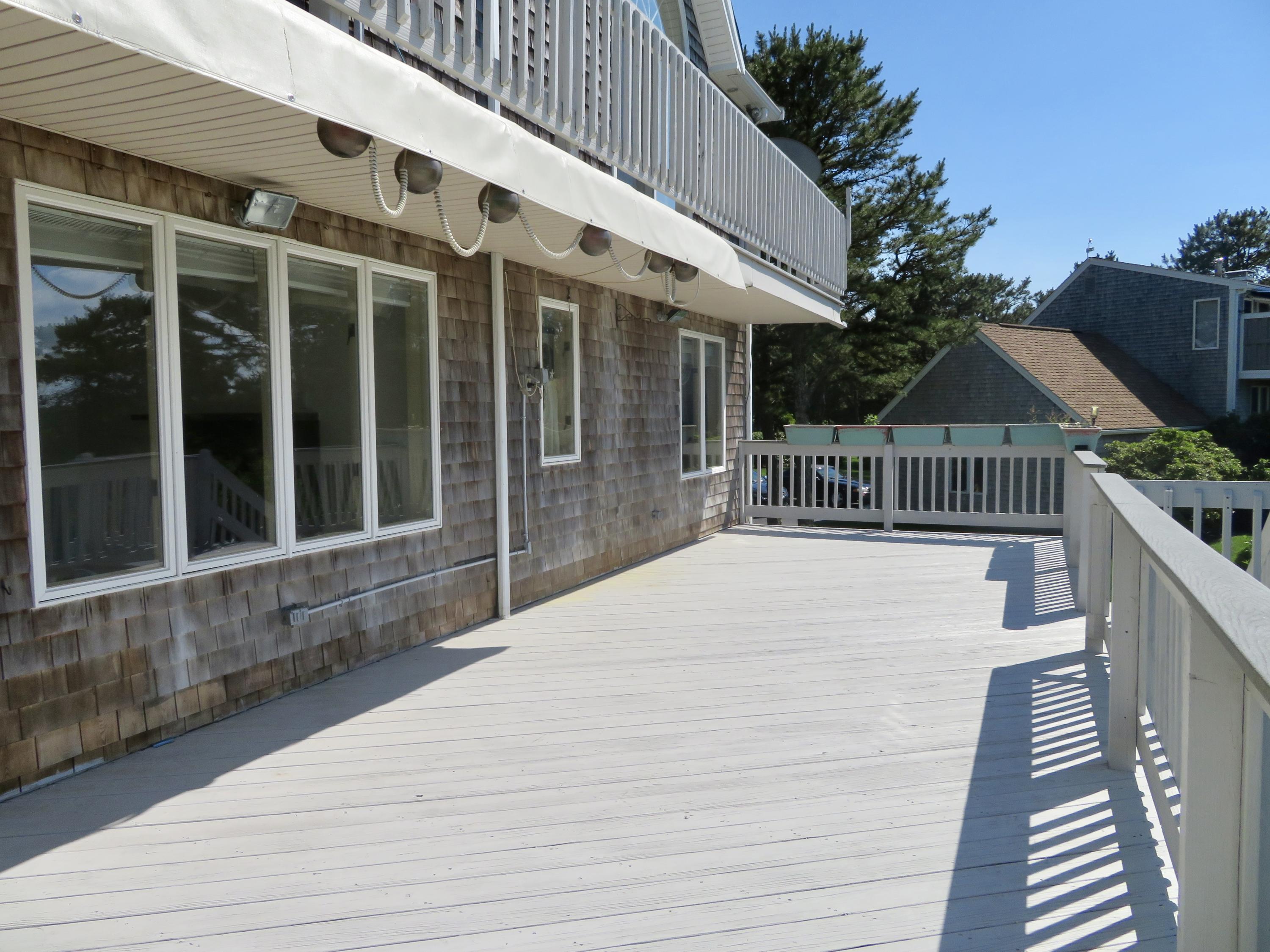 19 Long Boat Road Bourne, MA 02532 - Photo 27 of 33 a front view of a house with a balcony