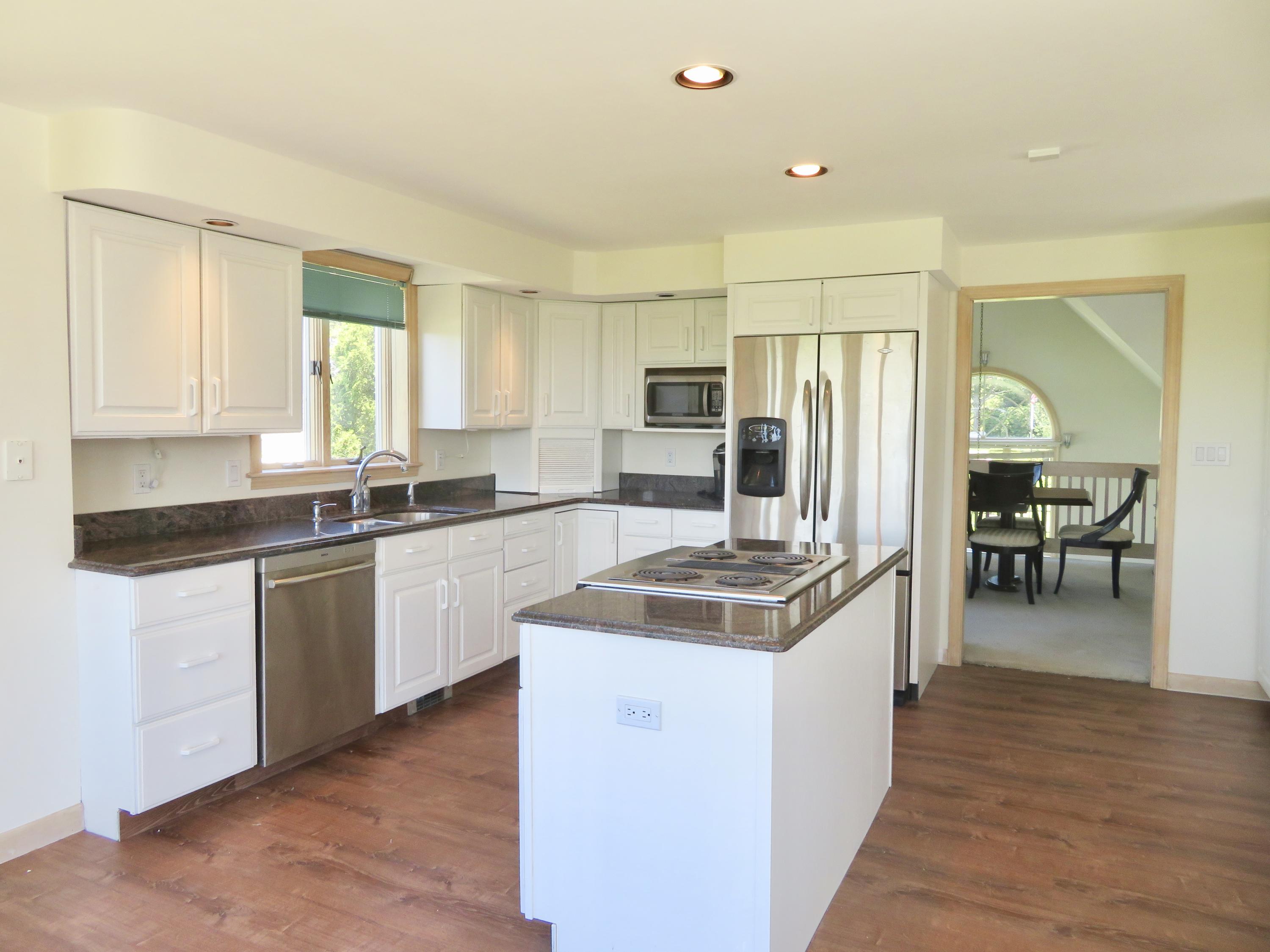 19 Long Boat Road Bourne, MA 02532 - Photo 5 of 33 a kitchen with stainless steel appliances granite countertop a stove refrigerator and a sink
