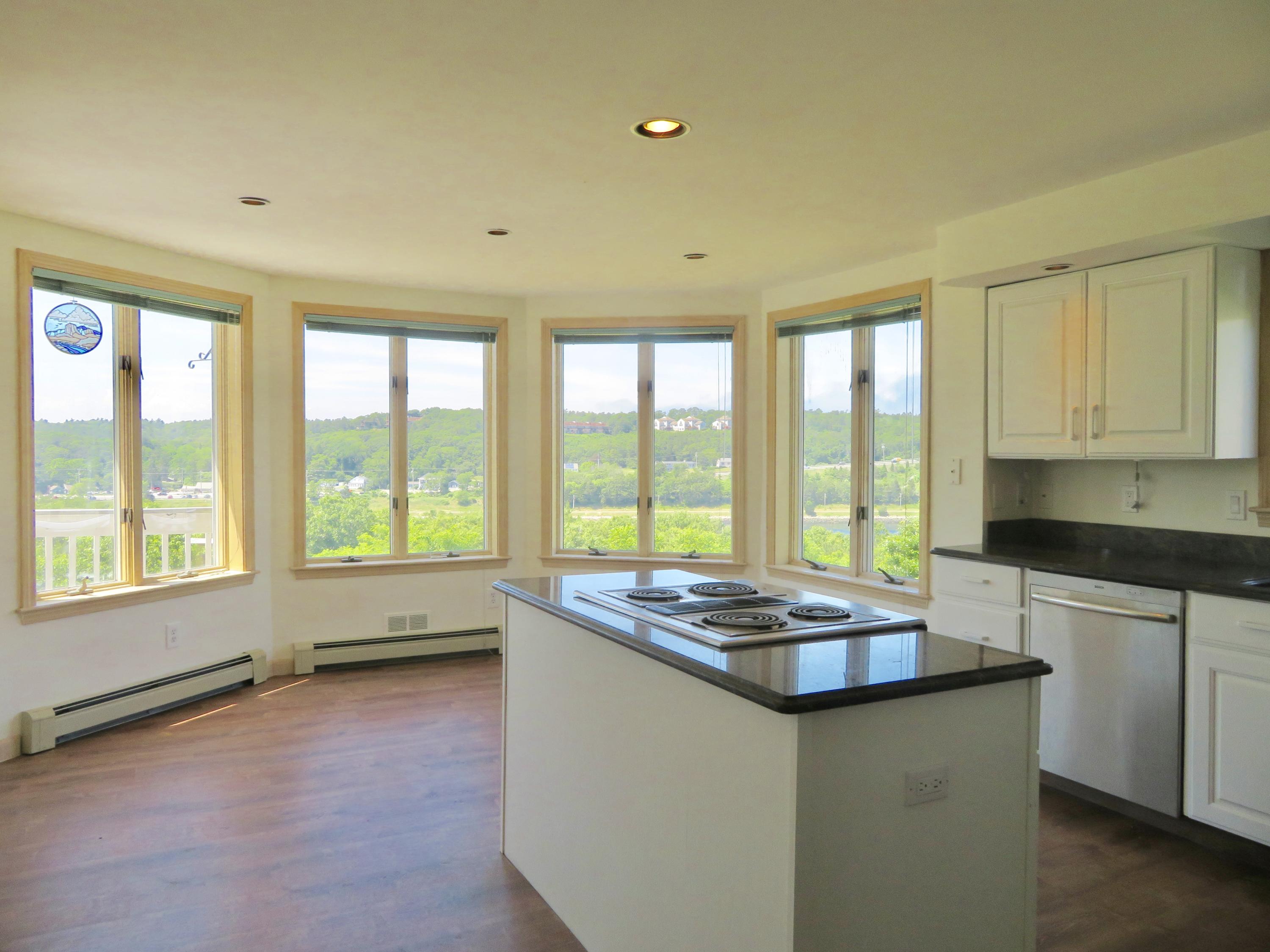 19 Long Boat Road Bourne, MA 02532 - Photo 6 of 33 a kitchen with granite countertop sink stove and cabinets