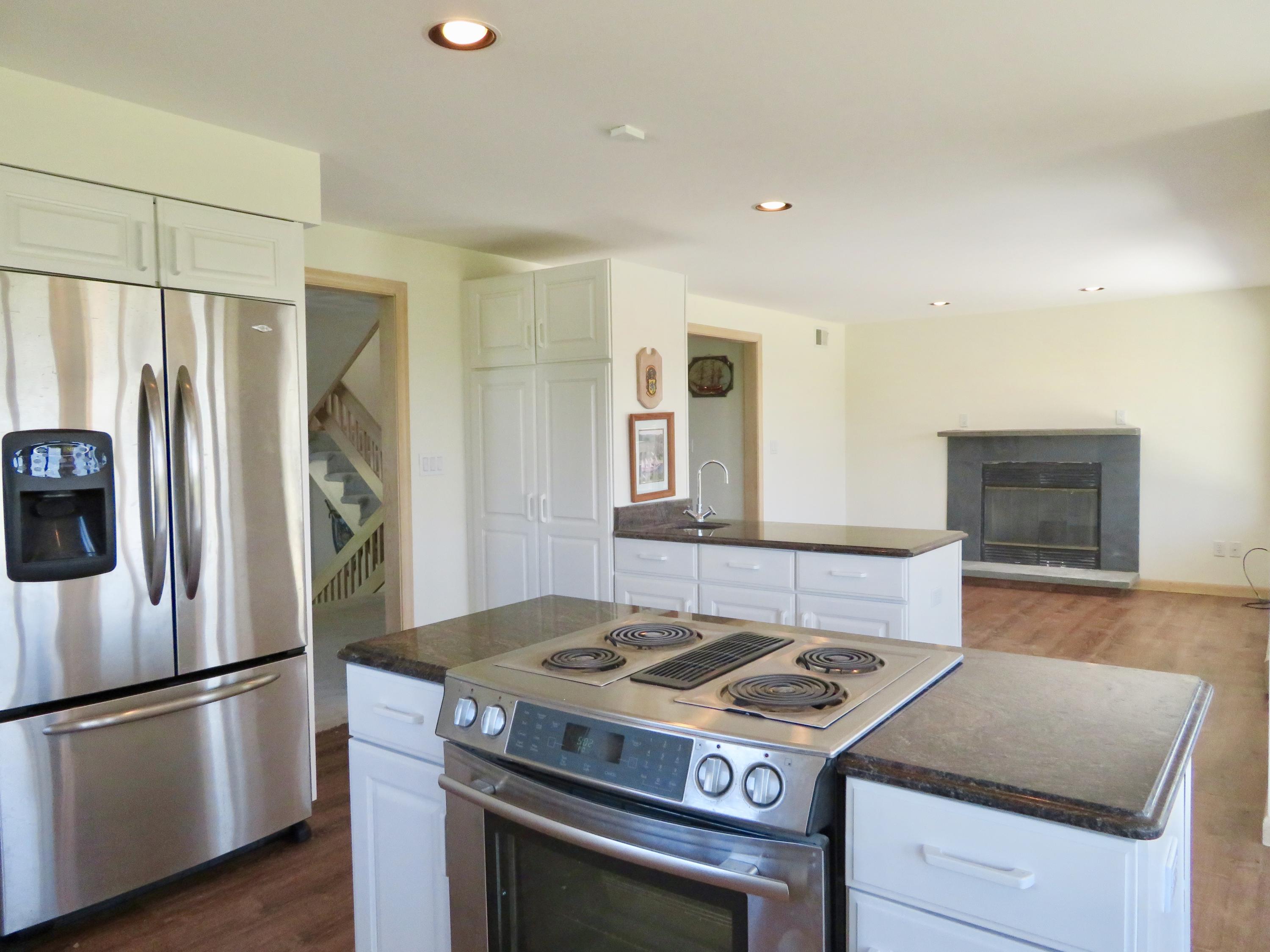19 Long Boat Road Bourne, MA 02532 - Photo 8 of 33 a kitchen with stainless steel appliances granite countertop a stove and a refrigerator