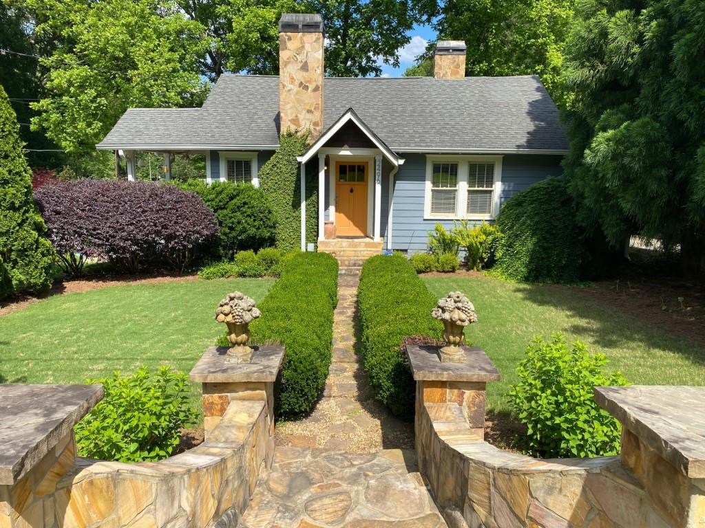 2496 Constance Street East Point, GA 30344 - Photo 1 of 1 a front view of a house with a yard and green space