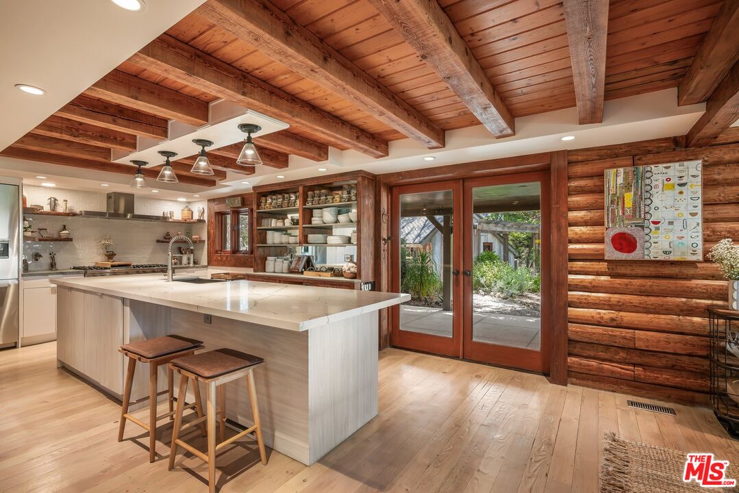 7336 Studio Road West Hills, CA 91304 - Photo 11 of 56 a kitchen with a sink a counter top space and furniture