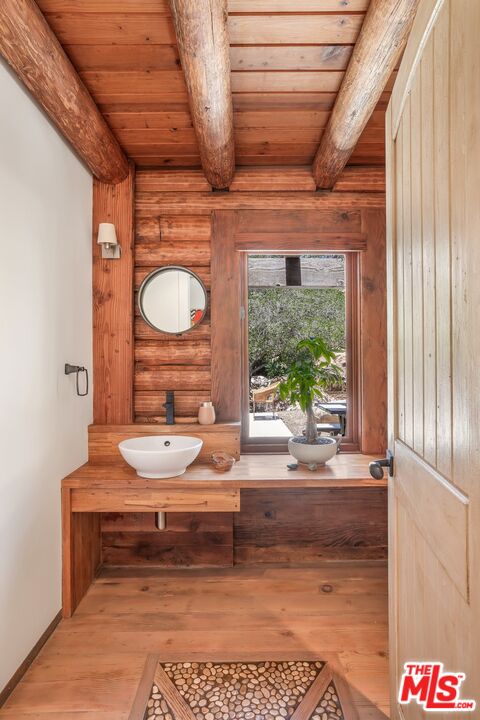 7336 Studio Road West Hills, CA 91304 - Photo 15 of 56 a bathroom with a sink and a mirror