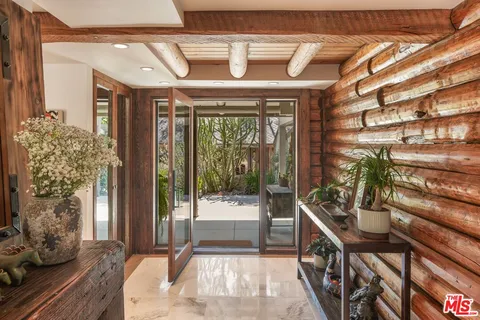 a view of an entryway with wooden floor