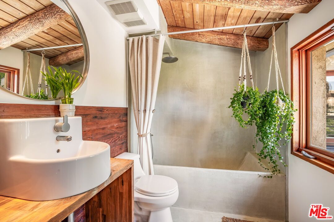 7336 Studio Road West Hills, CA 91304 - Photo 22 of 56 a bathroom with a sink toilet and shower