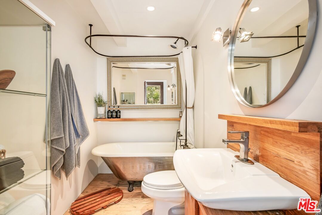 7336 Studio Road West Hills, CA 91304 - Photo 26 of 56 a bathroom with a sink a toilet and a mirror