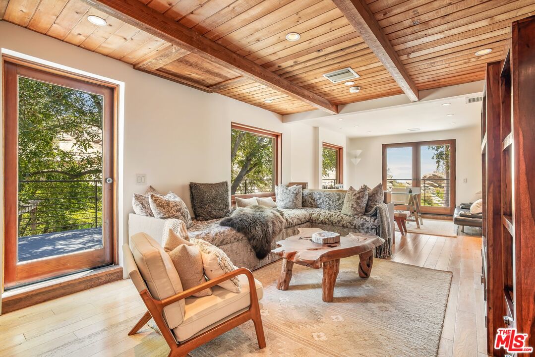 7336 Studio Road West Hills, CA 91304 - Photo 29 of 56 a living room with furniture and a large window